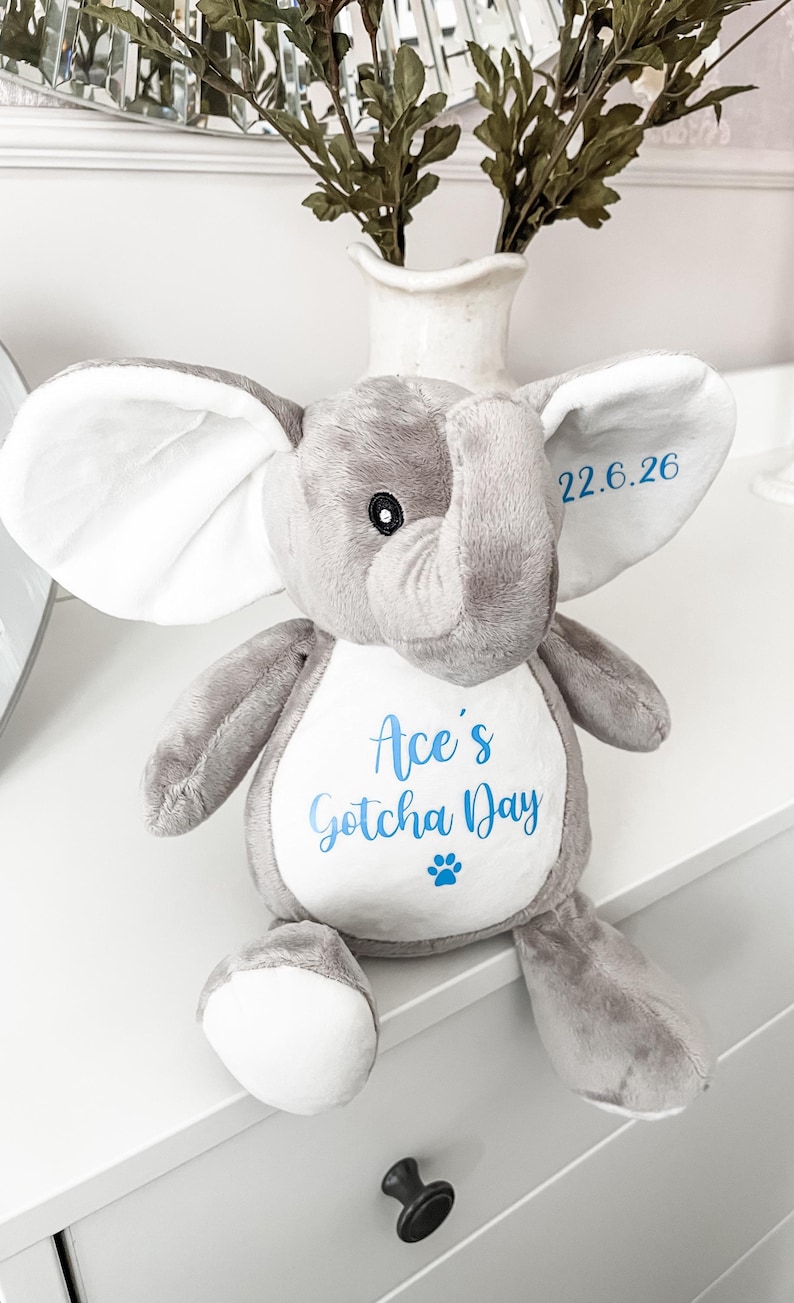 Plush personalised elephant dog toy for gotcha day gift, personalised with the dog's name and text underneath 'gotcha day' with the gotcha date personalised on the elephant's ear. Custom new puppy gift.