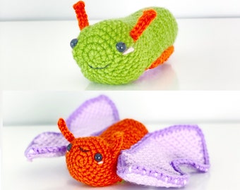 May include: Two crocheted stuffed toys. The first is a green slug with orange antennae and black eyes. The second is a purple and orange butterfly with black eyes.