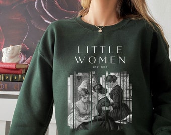 May include: A dark green sweatshirt with a white graphic print of the text "LITTLE WOMEN EST. 1868" and a black and white illustration of four women in a room.