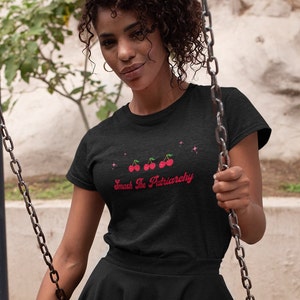 May include: Black t-shirt with a red graphic of cherries and the text "Smash The Patriarchy".