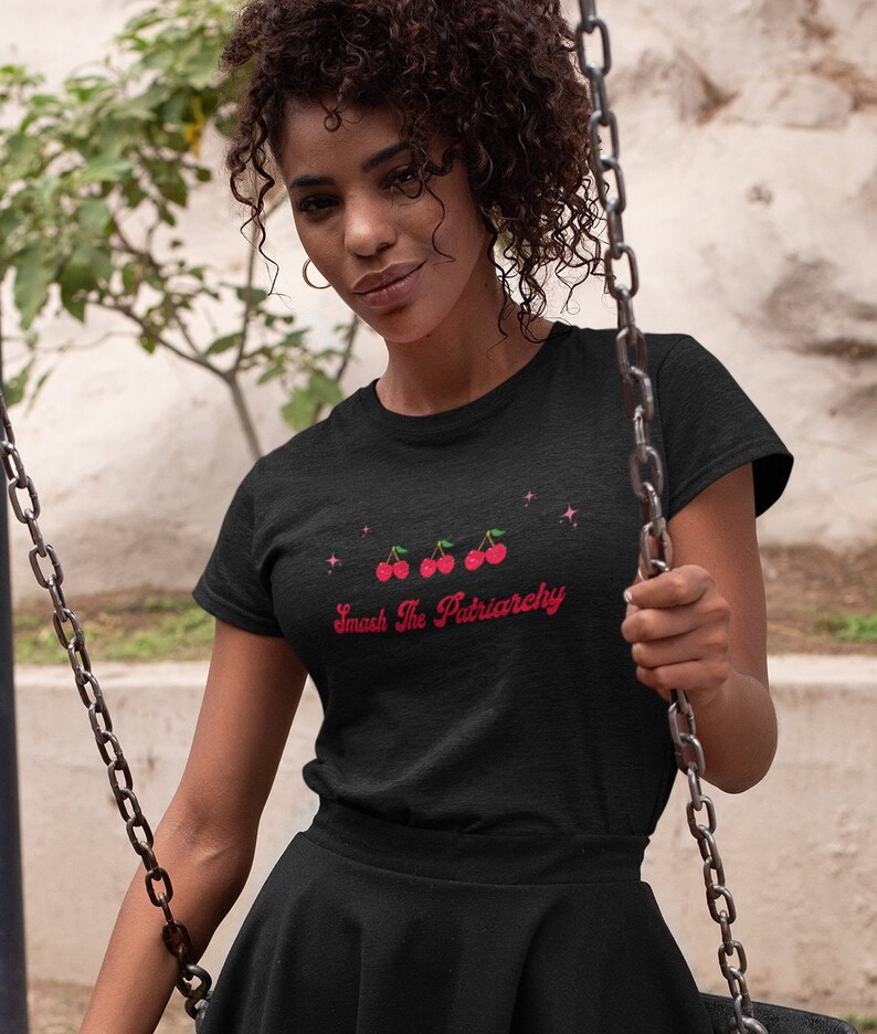 May include: Black t-shirt with a red graphic of cherries and the text "Smash The Patriarchy".