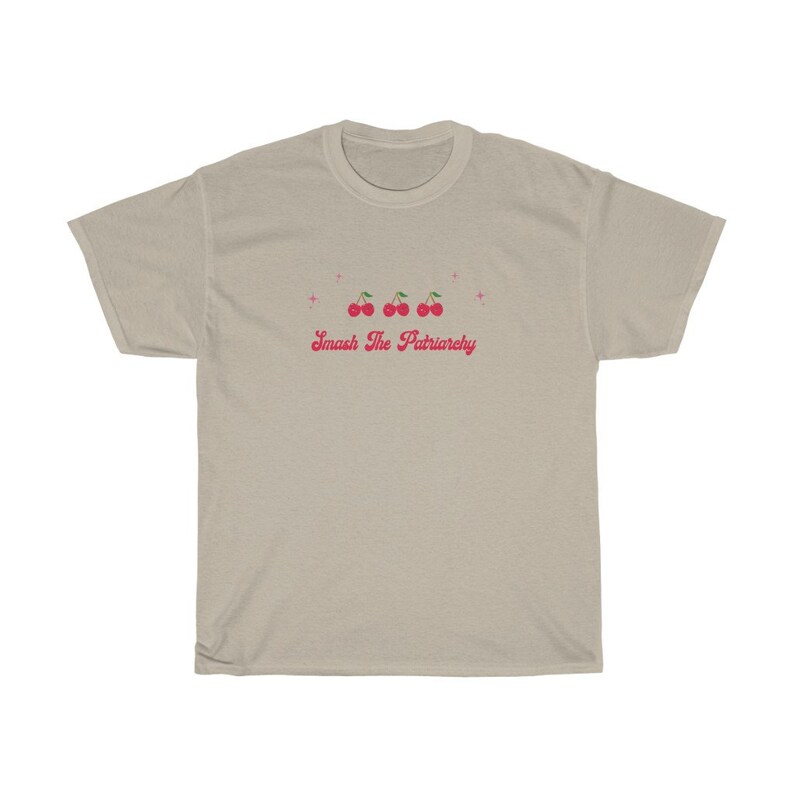 May include: A light beige t-shirt with a pink graphic of cherries and the text "Smash The Patriarchy".
