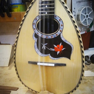 Traditional mandolin handmade with round body.