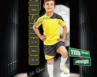 May include: A black and white banner with a young boy in a yellow soccer jersey and black shorts. The boy is standing with his right foot on a soccer ball. The banner has the text "ROBINSON" in large yellow letters and "Cubs Soccer 20XX" in smaller white letters. The banner also has a green street sign with the text "11th Street Design".