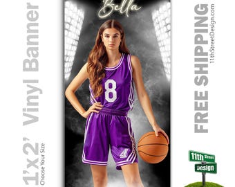 May include: A basketball player in a purple jersey with the number 8 on it, holding a basketball. The background is a black and white basketball court with spotlights.