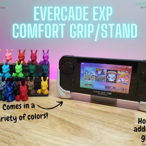 May include: A white 3D printed stand for the Evercade EXP handheld gaming console. The stand allows the console to be used as a stand-alone device or to hold an additional game cartridge. The stand comes in a variety of colours.