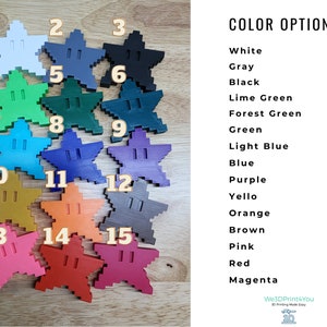 May include: Fifteen color options for 3D printed star-shaped objects. The colors are white, gray, black, lime green, forest green, green, light blue, blue, purple, yellow, orange, brown, pink, red, and magenta.