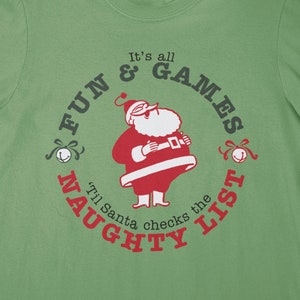 Funny Christmas SVG – It’s All Fun & Games ‘Til Santa Checks the Naughty List – Funny Christmas Tee Shirts Design - Iron-on Vinyl - Cricut