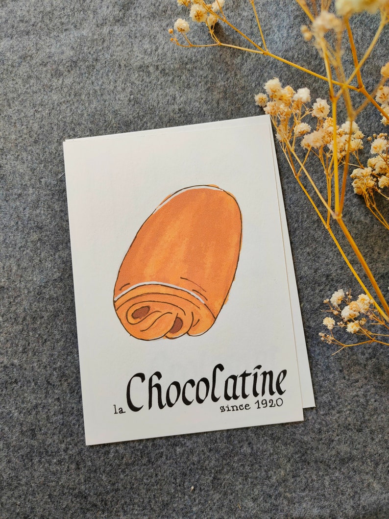 Carte postale : Baguette | Croissant | Chocolatine | Croissant | Crêpe | Macaron | Café | Chouquette | Croque-Monsieur Chocolatine