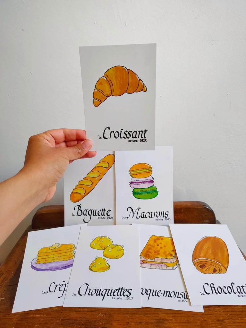 Carte postale : Baguette | Croissant | Chocolatine | Croissant | Crêpe | Macaron | Café | Chouquette | Croque-Monsieur image 1