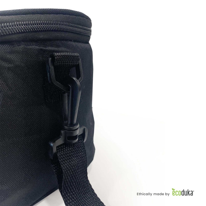 May include: Close-up of a black insulated bag with a zipper closure and a detachable shoulder strap. The bag features a black plastic clip and a woven strap. The bag is set against a white background.