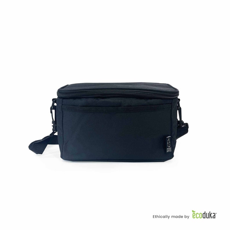 May include: A black insulated lunch bag with a zippered top and a front pocket. It has a detachable shoulder strap and a small logo on the side. The bag is rectangular and appears to be made of a durable fabric.