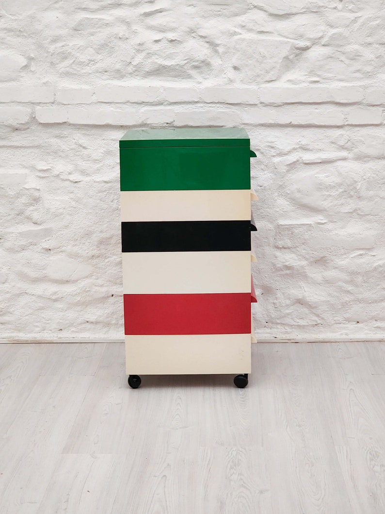 Plastic stacking drawers in red white black green by simon fussell