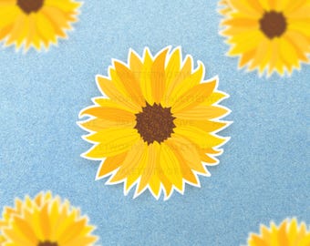 May include: Five yellow sunflower stickers on a light blue background. The sunflowers have a brown center and yellow petals.