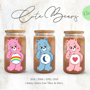 May include: Three glass beverage cans with wooden lids and straws, each featuring a different Care Bear design. The cans are labeled "Cute Bears" and are available in 16oz and 20oz sizes. The designs include a rainbow, a moon and stars, and a heart.