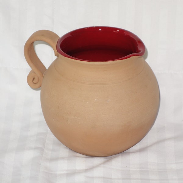 Vintage Hand thrown clay Italian pitcher with brilliant red inside