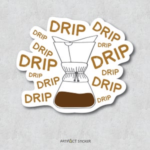 May include: A white sticker with a brown coffee maker and the word "DRIP" repeated around the image. The text is in a distressed font. The sticker has the words "ARTIFACT STICKER" at the bottom.