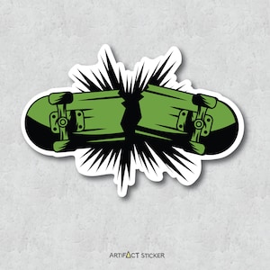 May include: A sticker of two green skateboards with black wheels, broken in half and exploding outward with black and white rays.