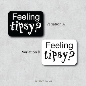May include: Two variations of a black and white sticker with the text "Feeling tipsy?" in a stylized font. The sticker is rectangular and has a white background with black text in the first variation and a black background with white text in the second variation.