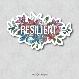 May include: A sticker with a watercolor floral design in shades of blue, red, and purple. The word "RESILIENT" is written in white letters in the center of the design.
