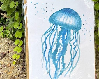 Tarjeta de felicitación con acuarela de medusas (interior en blanco; incluye un sobre)