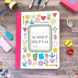 May include: A white journal with a pink spine and colourful illustrations of summer-themed icons. The cover reads "SUMMER JOURNAL" and has a space to write the year.