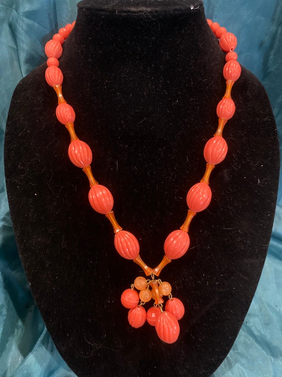 Vintage 50s MCM celluloid orange flapper style ne… - image 1