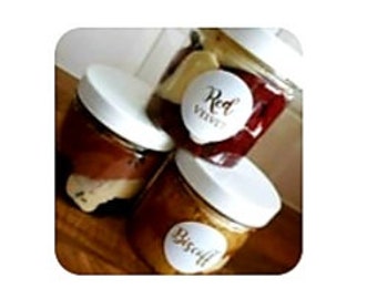 May include: Three glass jars with lids, filled with different colored desserts. The jars are labeled "Red Velvet", "Biscoff", and "Chocolate".