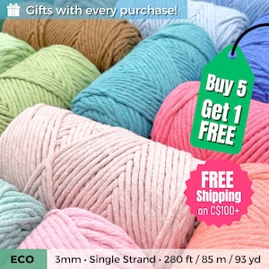 May include: A collection of colorful spools of 3mm single-strand yarn in various shades, including pink, teal, green, and blue. The image includes text that reads "Buy 5 Get 1 FREE". The yarn is 280 ft / 85 m / 93 yd.