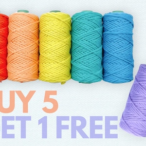 May include: A selection of brightly coloured macrame cord spools in orange, peach, yellow, teal, blue, and purple. The text "BUY 5 GET 1 FREE" is displayed below the spools.