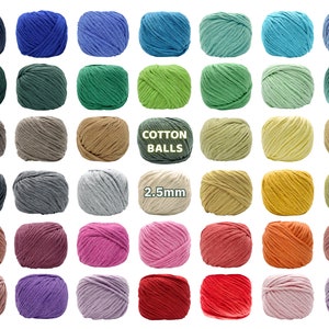 May include: A selection of colourful cotton yarn balls in shades of blue, green, brown, and pink. The text "COTTON BALLS" and "2.5mm" are visible. The yarn balls are arranged in a grid, displaying a variety of colours suitable for crafting. The yarn is 2.5mm thick.