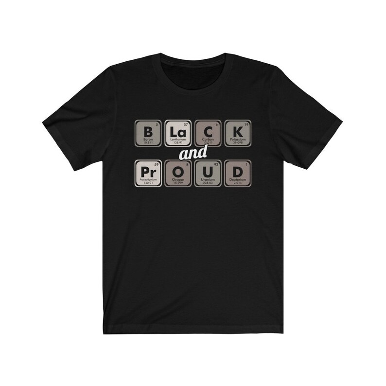 May include: Black t-shirt with the words "BLACK and PROUD" spelled out using periodic table elements. The design features the elements Boron, Lanthanum, Carbon, Potassium, Praseodymium, Oxygen, Uranium, and Deuterium.