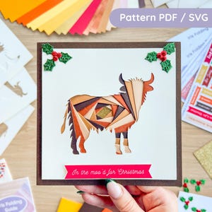 May include: A handmade Christmas card featuring a geometric bull design in shades of brown, orange, and gold. The card includes the text "In the moo'd for Christmas" on a red banner. Holly accents adorn the corners. The card is a Pattern PDF / SVG.