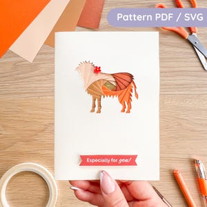 May include: A handmade greeting card featuring a layered paper design of a sheep in shades of orange, brown, and beige. The card includes the text "Especially for you!" and "Pattern PDF / SVG".