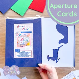 Traîneau du Père Noël et son renne (lot de 3) | Ouvertures rectangulaires blanches (x3), cartes vierges colorées (x3), enveloppes blanches C5 (x3)