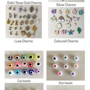 May include: Assortment of colorful beads and charms for jewelry making. Includes eye beads, star beads, heart beads, and charms in gold, silver, and colored finishes.