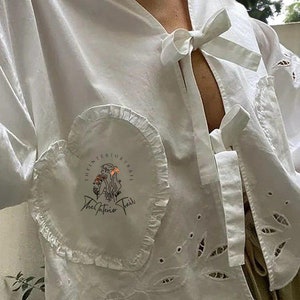 Elegant Women White Color Hollow Out Embroidery Long Puff Sleeves Shirt Fashoin V-neck Lace Up Lace Loose Blouse Casual Female Top