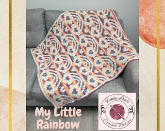 May include: A colourful crochet blanket with a rainbow pattern, draped over a grey sofa. The blanket is made with a variety of colours, including pink, purple, blue, green, yellow, and orange. The text "My Little Rainbow" is written below the blanket. The text "Funky Loops Crochet Design" is written in a circle with a ball of yarn and crochet hook.