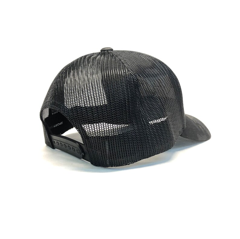 May include: Black mesh trucker hat with a black brim. The hat has a black adjustable strap with a plastic buckle.