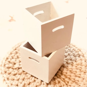 Little white decorative storage boxes