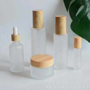 1-200pcs Conjuntos de embalagens cosméticas Conta-gotas/Spray/Loção/Creme/Rolo Tampa de grão de madeira Vidro fosco Óleo essencial Beleza Maquiagem Pedido em massa