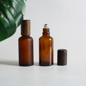 1-200pcs 15ml-100ml Clear/Frosted Amber Glass Roller Bottles SPA Oil Perfume Essential Oil Black Bamboo Wood Steel Ball Skin Care Pack Bulk