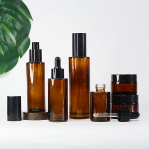 1-200pcs Cosmetic Stes Spray Bottle/Serum Lotion/Dropper/Cream Jar Clear Flat Shoulder Amber Glass Black Cap Hot Sample Order Wholesale
