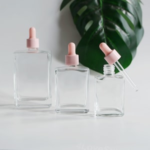 Flacone contagocce vuoto da 30 ml/50 ml/100 ml, contagocce rosa, in gomma trasparente, quadrato, in vetro, contenitore per oli essenziali, per la cura della pelle, alla rinfusa