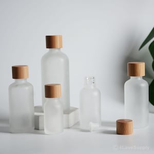 1-100pcs 5ml 15ml 30ml 50ml 100ml Frasco de óleo essencial de vidro fosco fosco, vazio, frasco de óleo de SPA, embalagem de madeira de bambu natural, a granel