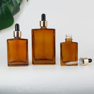 30ml 50ml 100ml Empty Dropper Bottle,Light Gold Cover,Square Clear Amber Glass With Pipettenflasche Cosmetic Glass Dropper Bottle Wholesale