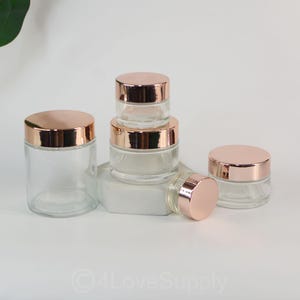 2025 New Cream Tiegel 5g 15g 50g 100g Rose Gold Matel Cap, transparentes Glas für Sahnetopf, Gesichtscreme Lotion, Kosmetik Gläser Einzelverkauf