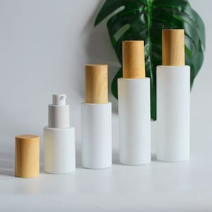 30ml 50ml 80ml 100ml Siero Lozione Pompa Bottiglie Opaco Bianco Vetro Effetto Legno Tappo Per Autunno Inverno Cura Della Pelle Contenitore Olio Essenziale Bulk