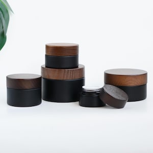 Krämburk med naturligt mörkt trälock, matt svart glasburk, hudvårdsburk, krämburk, kroppssmörburk, eterisk olja, grossist 15g-200g