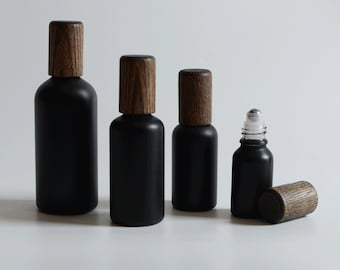 1-200 piezas de 15 ml-100 ml, botellas con rodillo para aceites esenciales de spa, perfumes, madera de bambú negra mate, bolas de acero, embalaje para el cuidado de la piel, venta al por mayor
